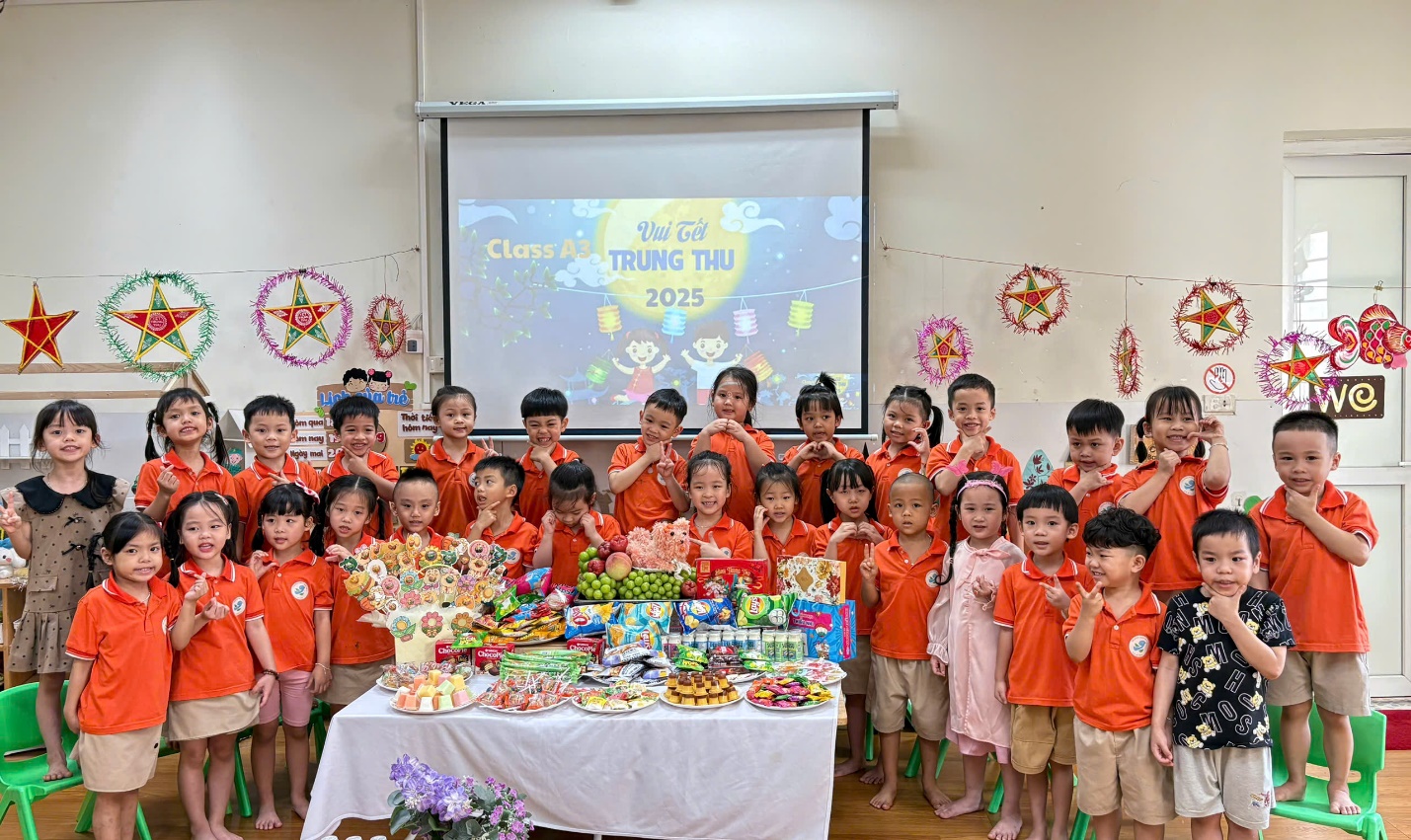 A group of children standing in front of a table with food

AI-generated content may be incorrect.