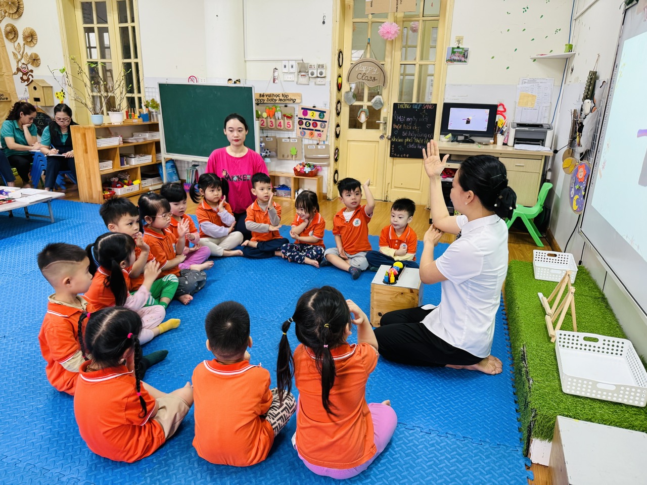 A group of children sitting on the floor in a classroom

AI-generated content may be incorrect.