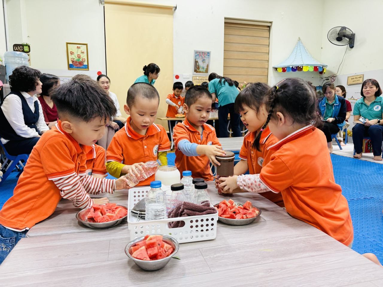 A group of children sitting at a table

AI-generated content may be incorrect.