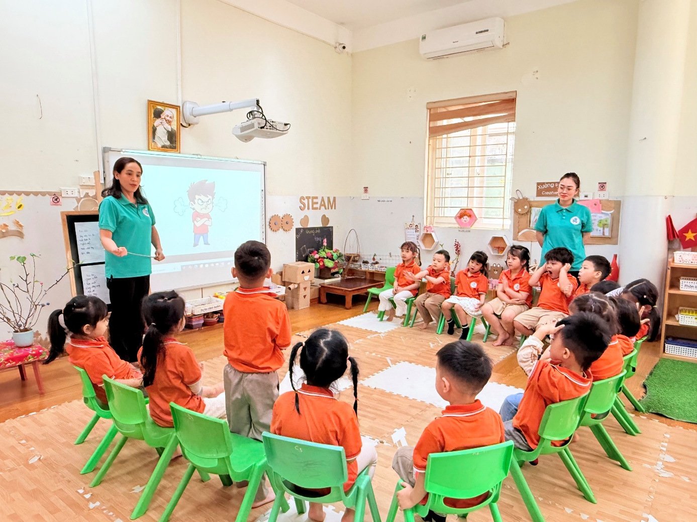 A group of children sitting in chairs in a classroom

AI-generated content may be incorrect.