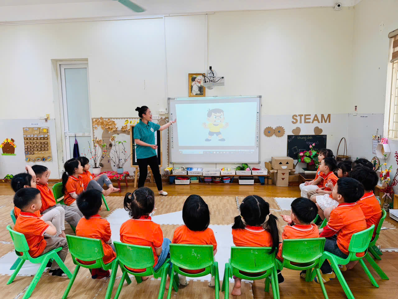 A group of children sitting in chairs in a classroom

AI-generated content may be incorrect.