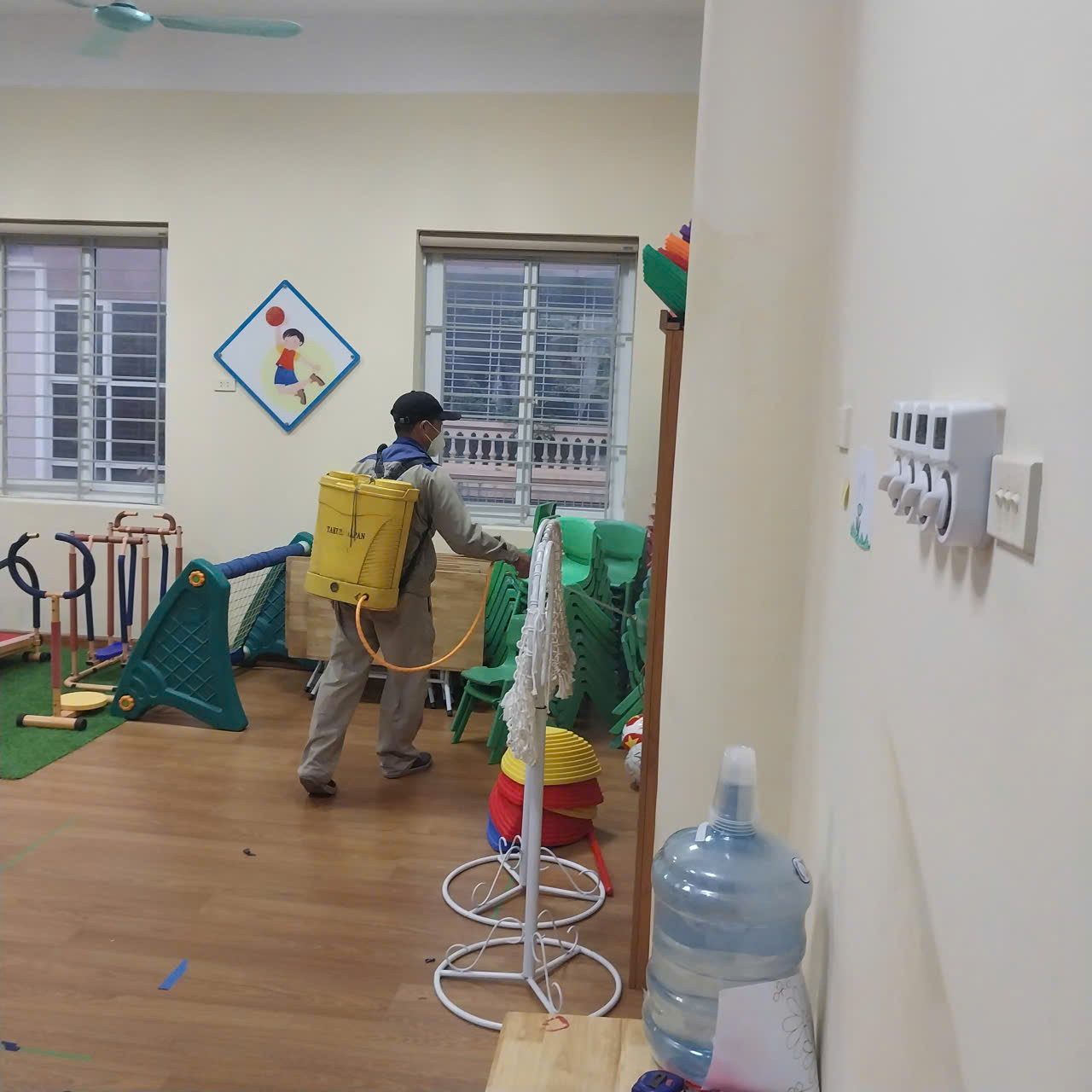 A person with a yellow backpack in a room with a toy
AI-generated content may be incorrect.