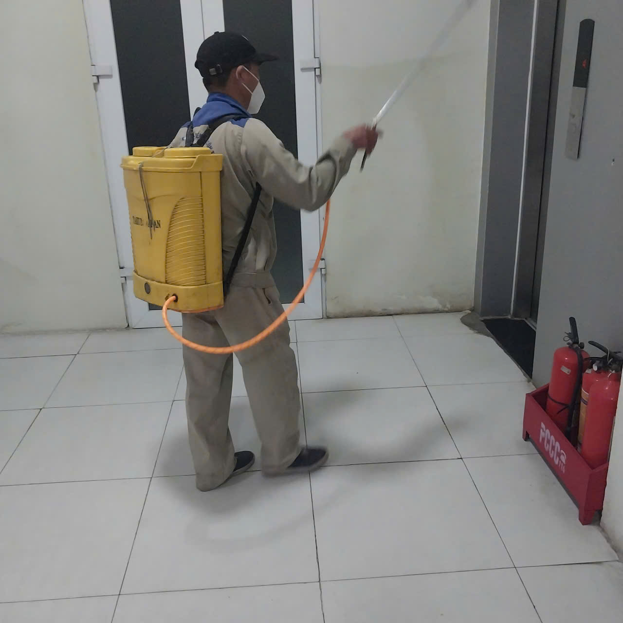 A person spraying a room
AI-generated content may be incorrect.