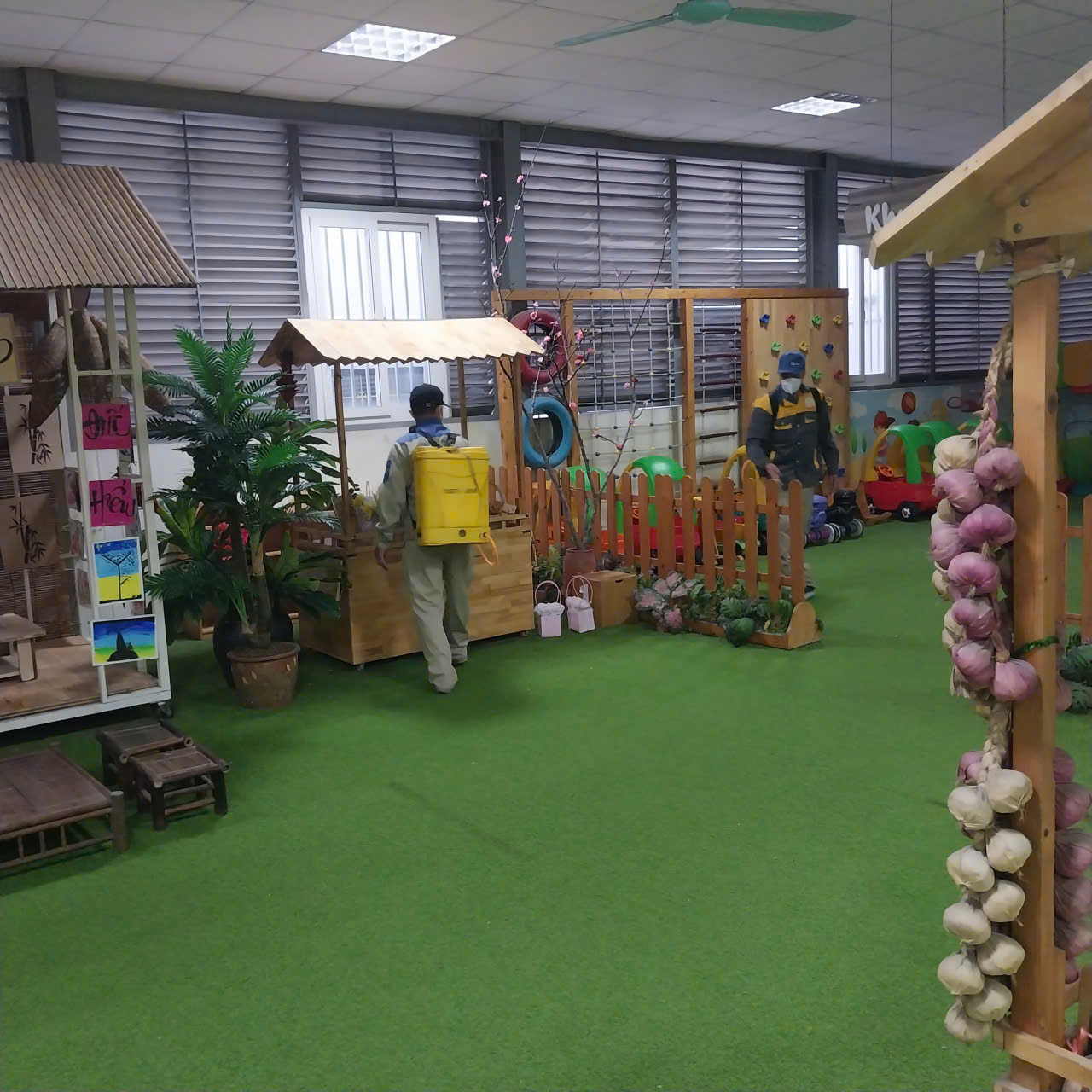 A room with a variety of toys and plants
AI-generated content may be incorrect.