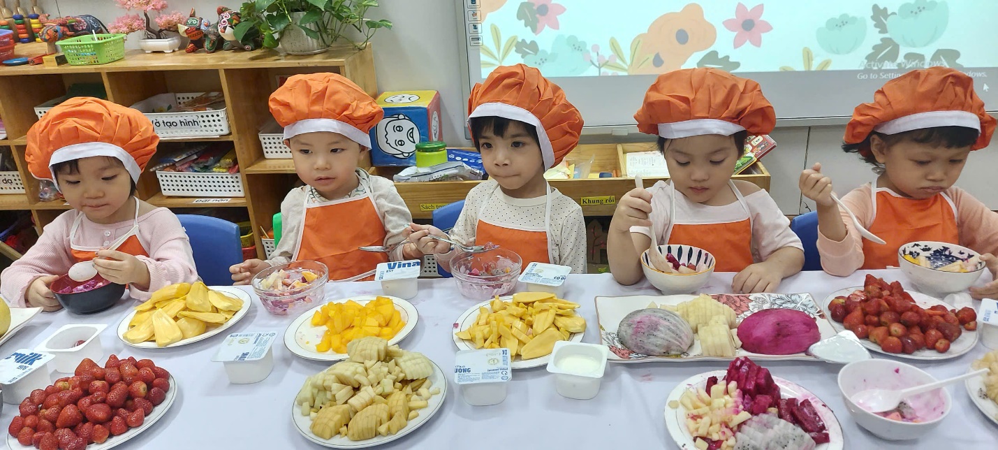 A group of children wearing chef hats and eating food
AI-generated content may be incorrect.