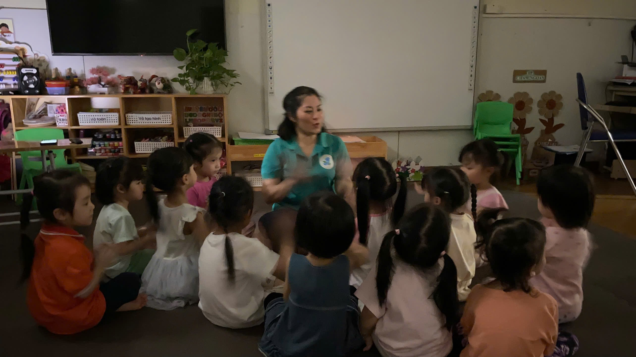 A group of children sitting on the floor

AI-generated content may be incorrect.