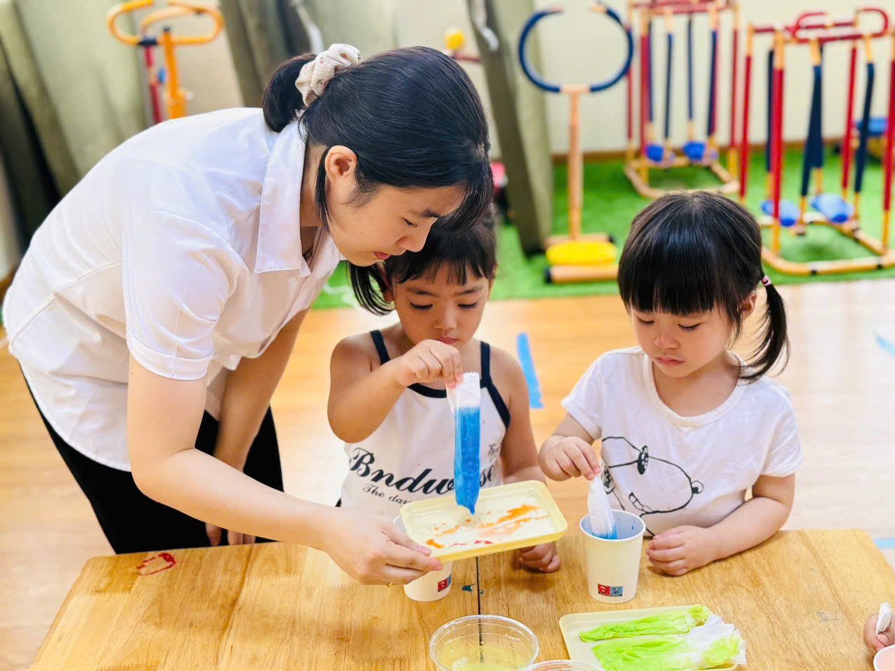 A person and two kids painting
AI-generated content may be incorrect.