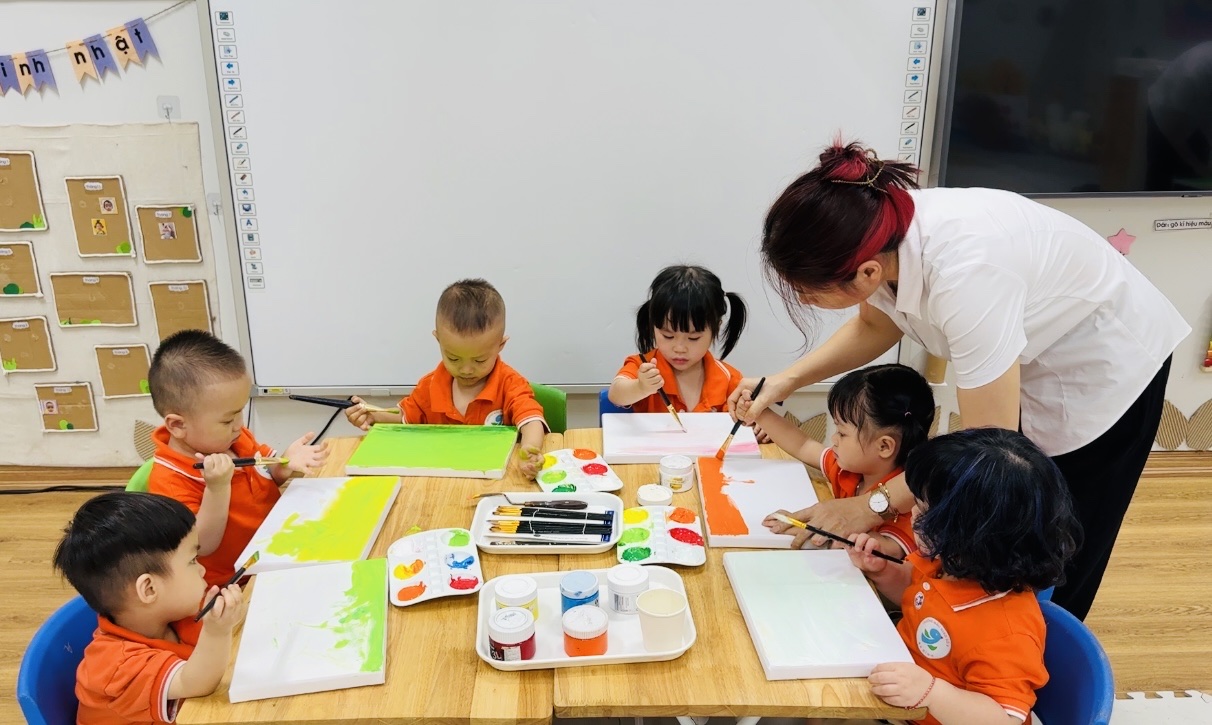 A group of children painting on paper
AI-generated content may be incorrect.