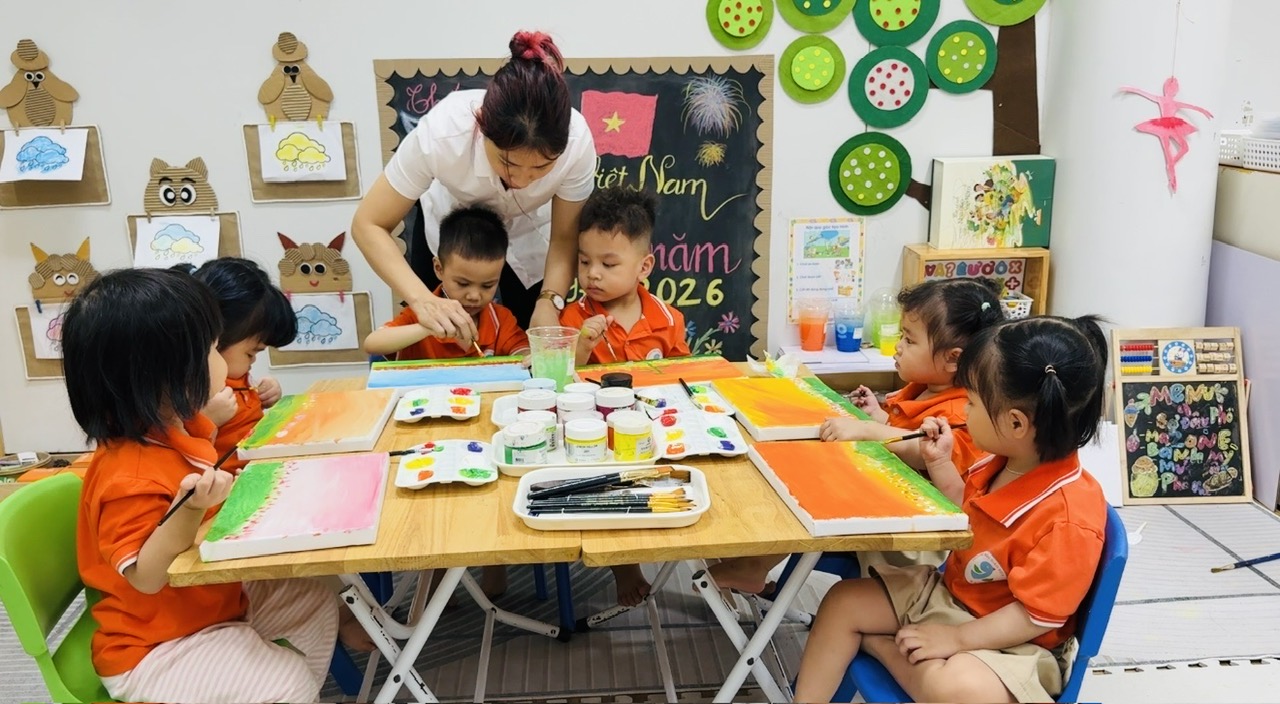 A group of children painting at a table
AI-generated content may be incorrect.