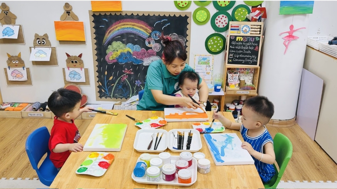 A group of children painting on a table
AI-generated content may be incorrect.